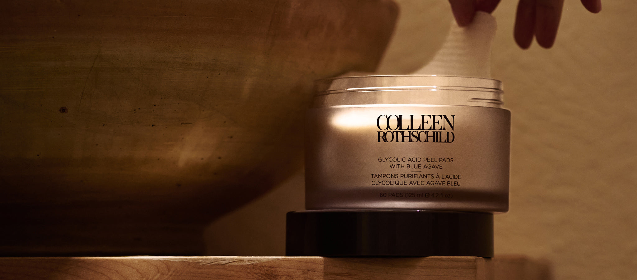 Colleen Rothschild Beauty Glycolic Acid Peel Pads next to sink.