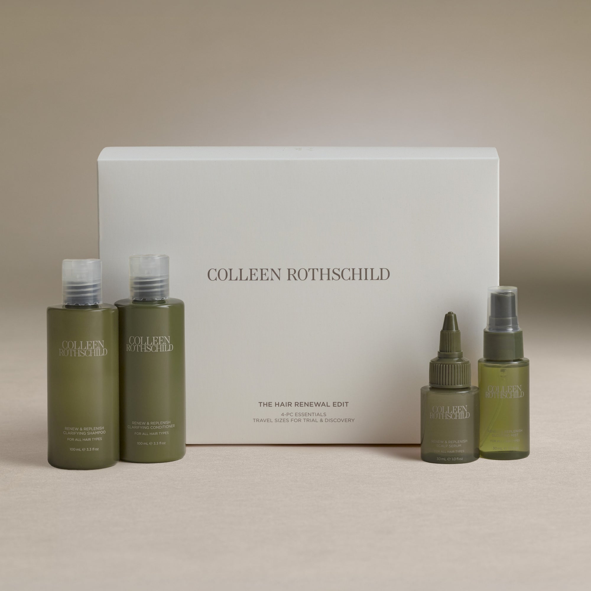 Colleen Rothschild hair renewal edit set featuring olive green bottles of shampoo, conditioner, and treatments arranged in front of a white product box on a neutral beige background.