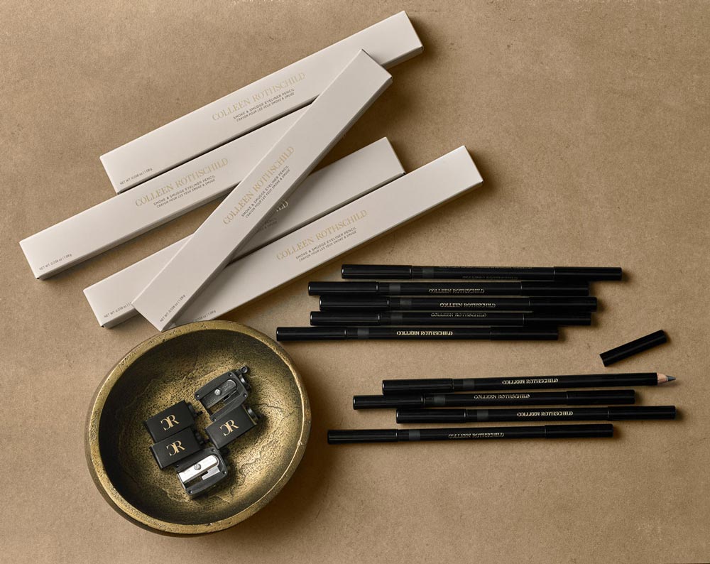 Eyeliner pencils and sharpeners in a gold dish.